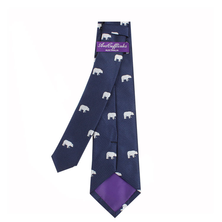 A Snowy Wildlife Tie with white bear prints, evoking a sense of Arctic wonder, and a purple label reading "Australiana" on the inside.