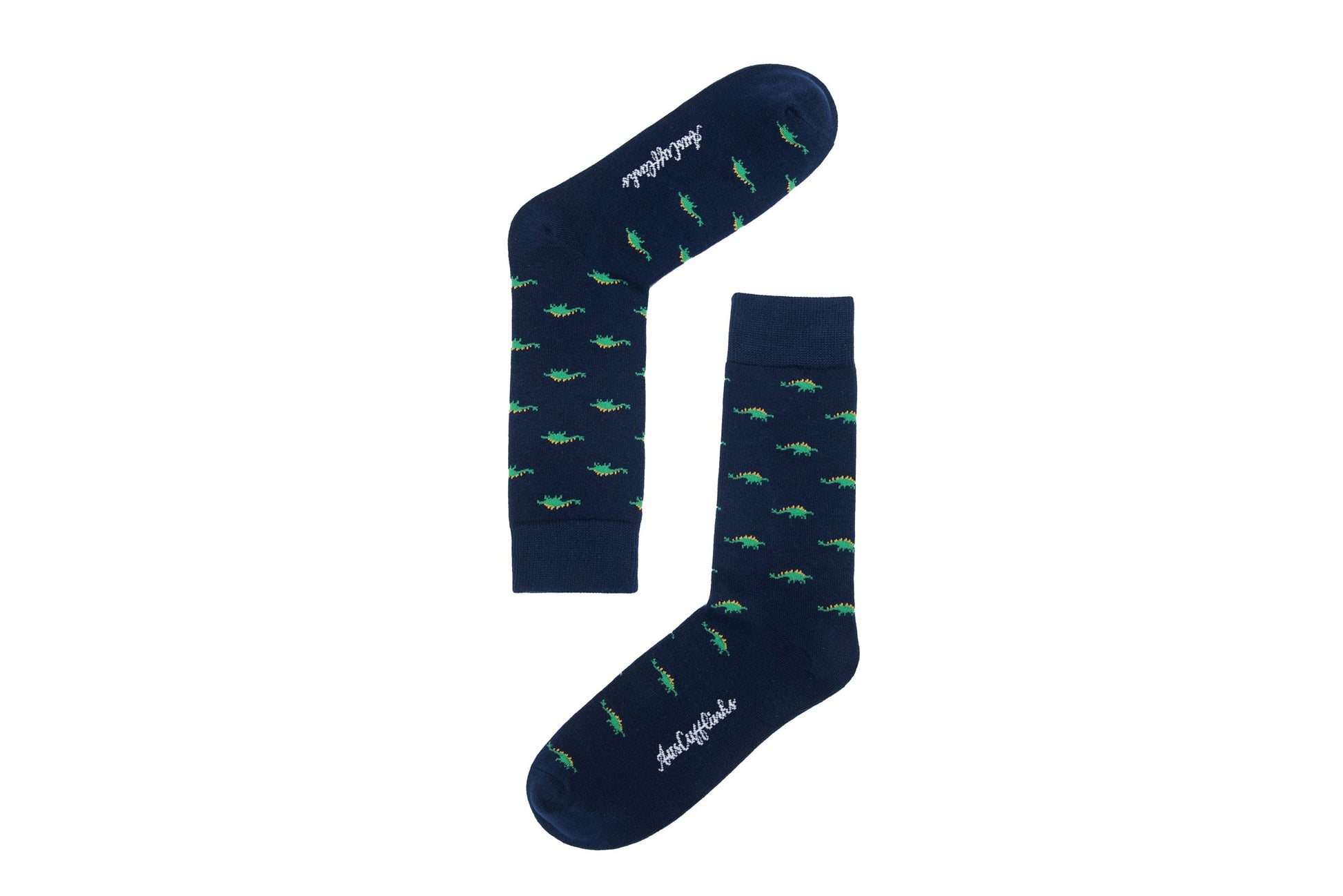 A pair of Stegosaurus Socks adorned with whimsical green dinosaur patterns displayed on a white background.