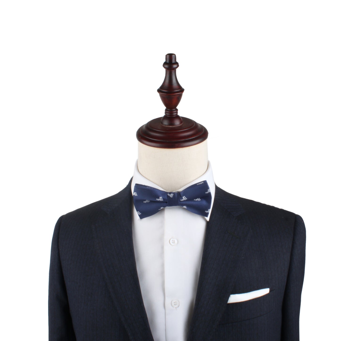 A mannequin exudes elegance, dressed in a dark suit with a white shirt and the Swimming Bow Tie in blue, set against a pristine white background.