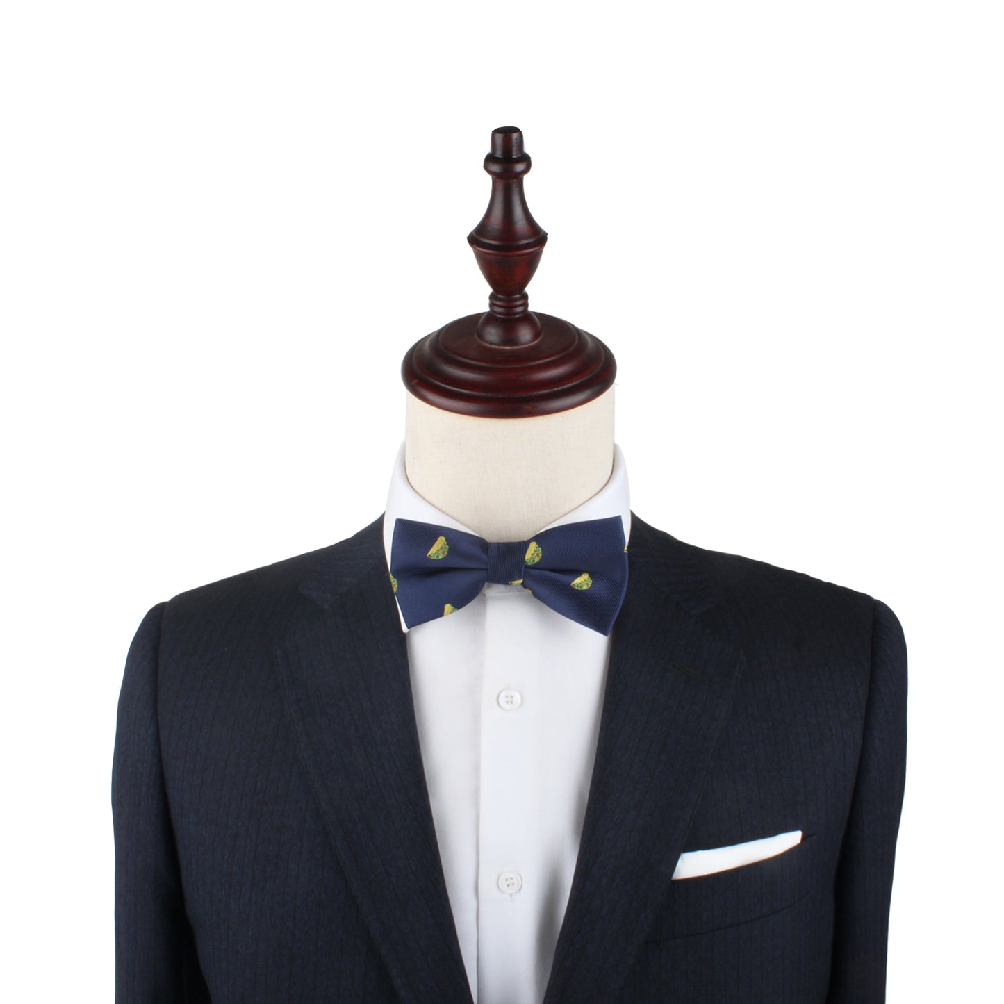 A mannequin dressed in a dark suit and white shirt, with a Taco Bow Tie featuring small green leaf patterns, embodies a style that's both spicy and flavorful.