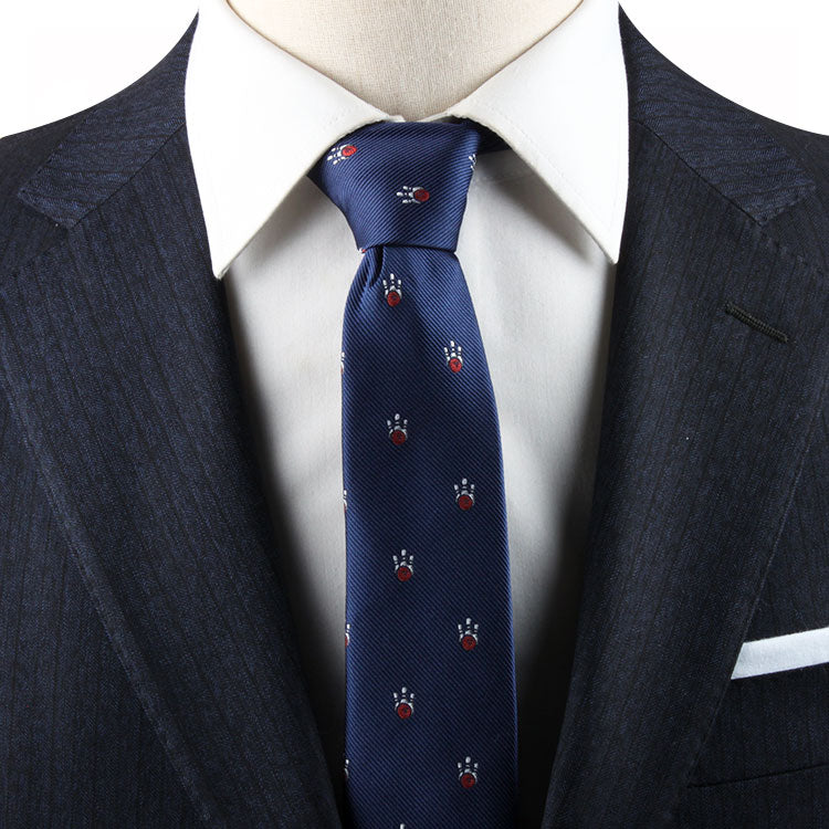 A person wearing a dark pinstriped suit with a white dress shirt and the Ten Pin Bowling Necktie, effortlessly harmonizing classic style with modern sophistication.
