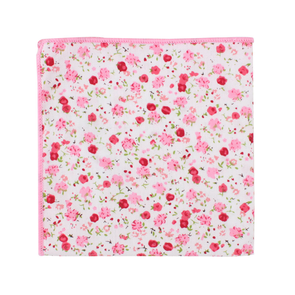The Tonal Pink Azalea Floral Cotton Skinny Tie & Pocket Square Set showcases a square cloth featuring a pink floral pattern on a white background, exuding an azalea-like grace that enhances its delicate hues.