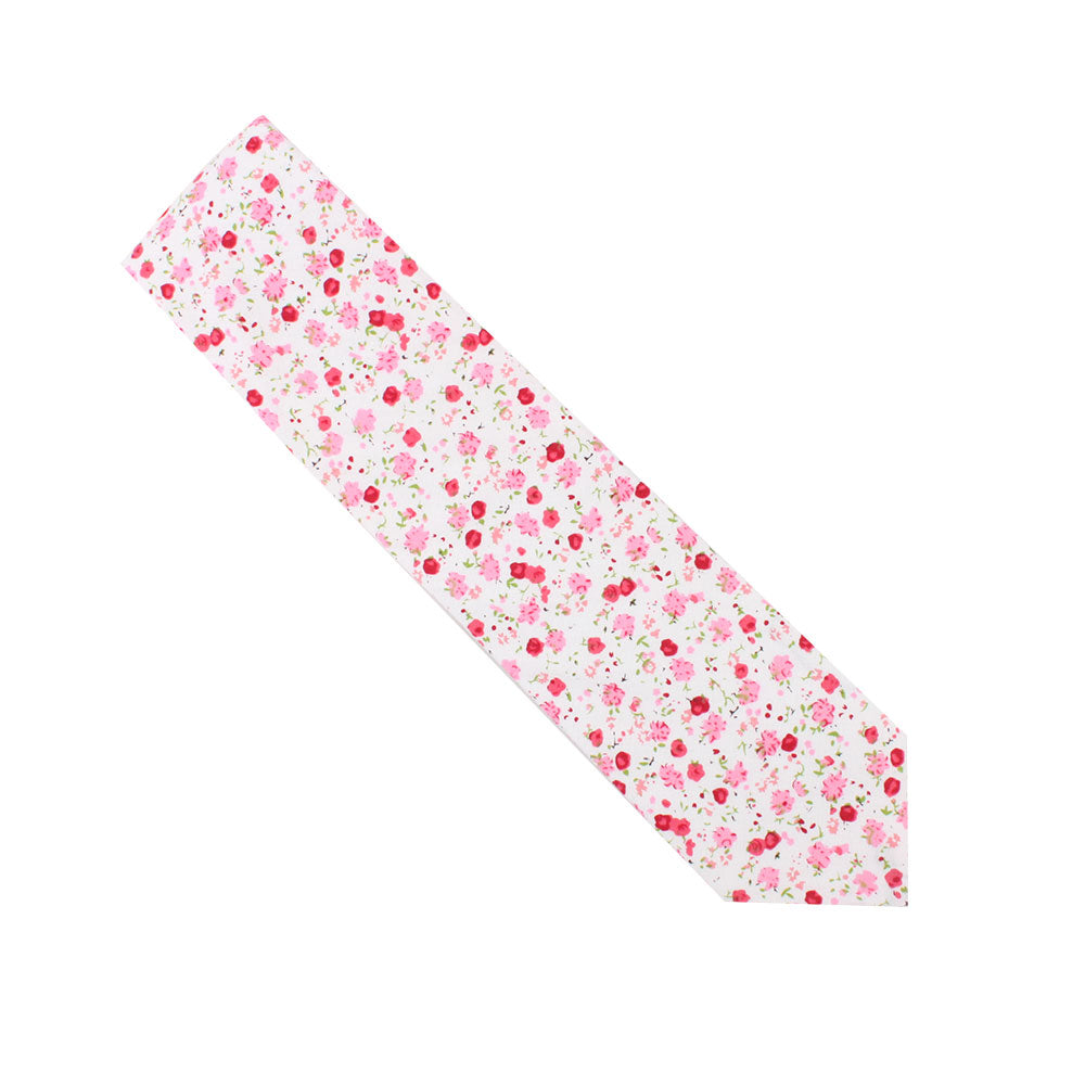 The Tonal Pink Azalea Floral Cotton Skinny Tie features a delicate floral pattern on a white background, highlighting soft pink hues.