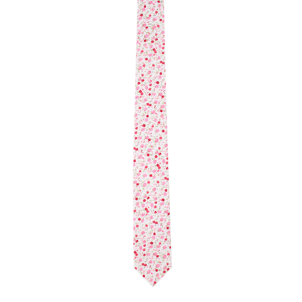 A narrow tie from the Tonal Pink Azalea Floral Cotton Skinny Tie & Pocket Square Set features a design in red and pink hues, evoking blooming azalea flowers against a crisp white background.