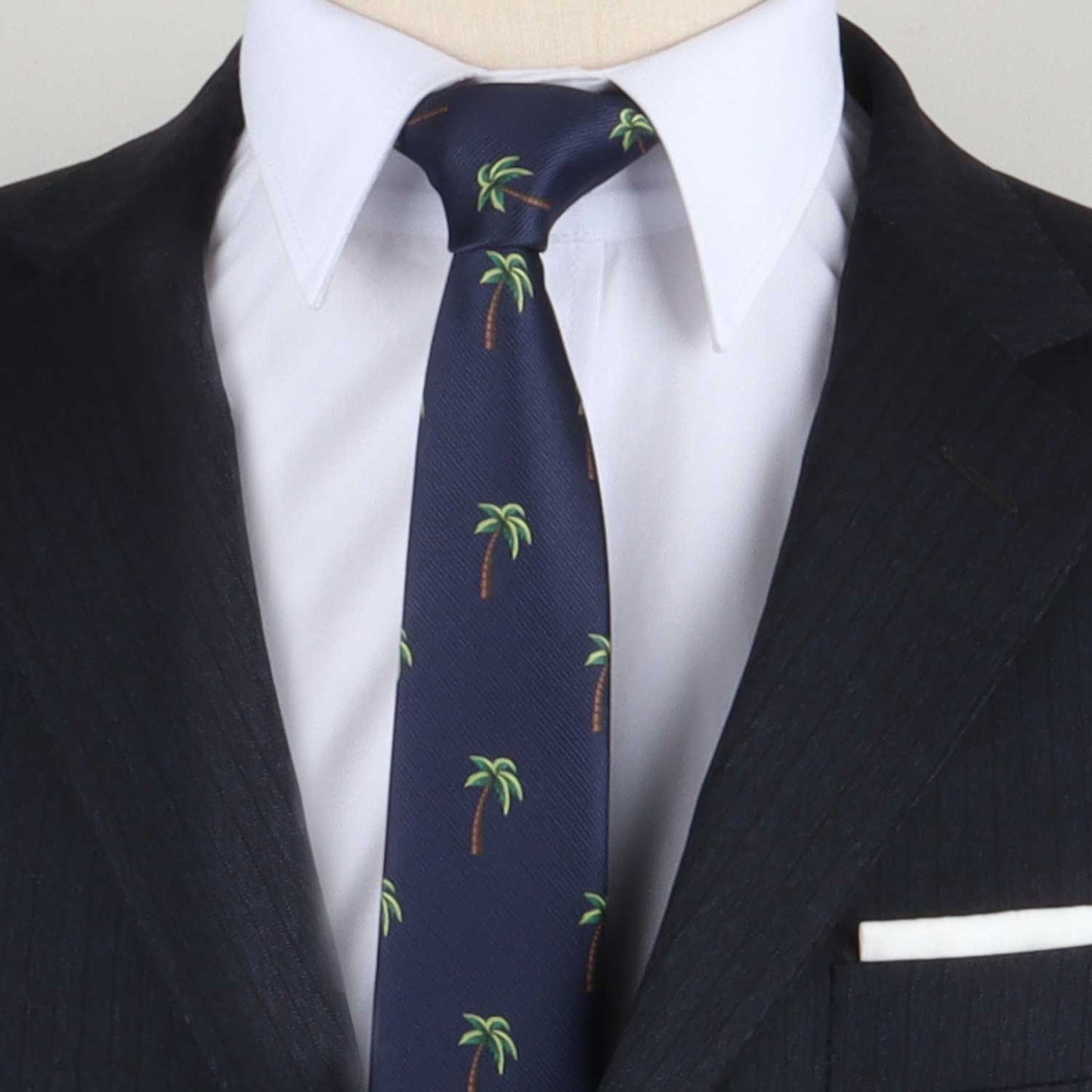 A person wearing a dark suit and light shirt with a Tropical Print Necktie, exuding a tropical allure.