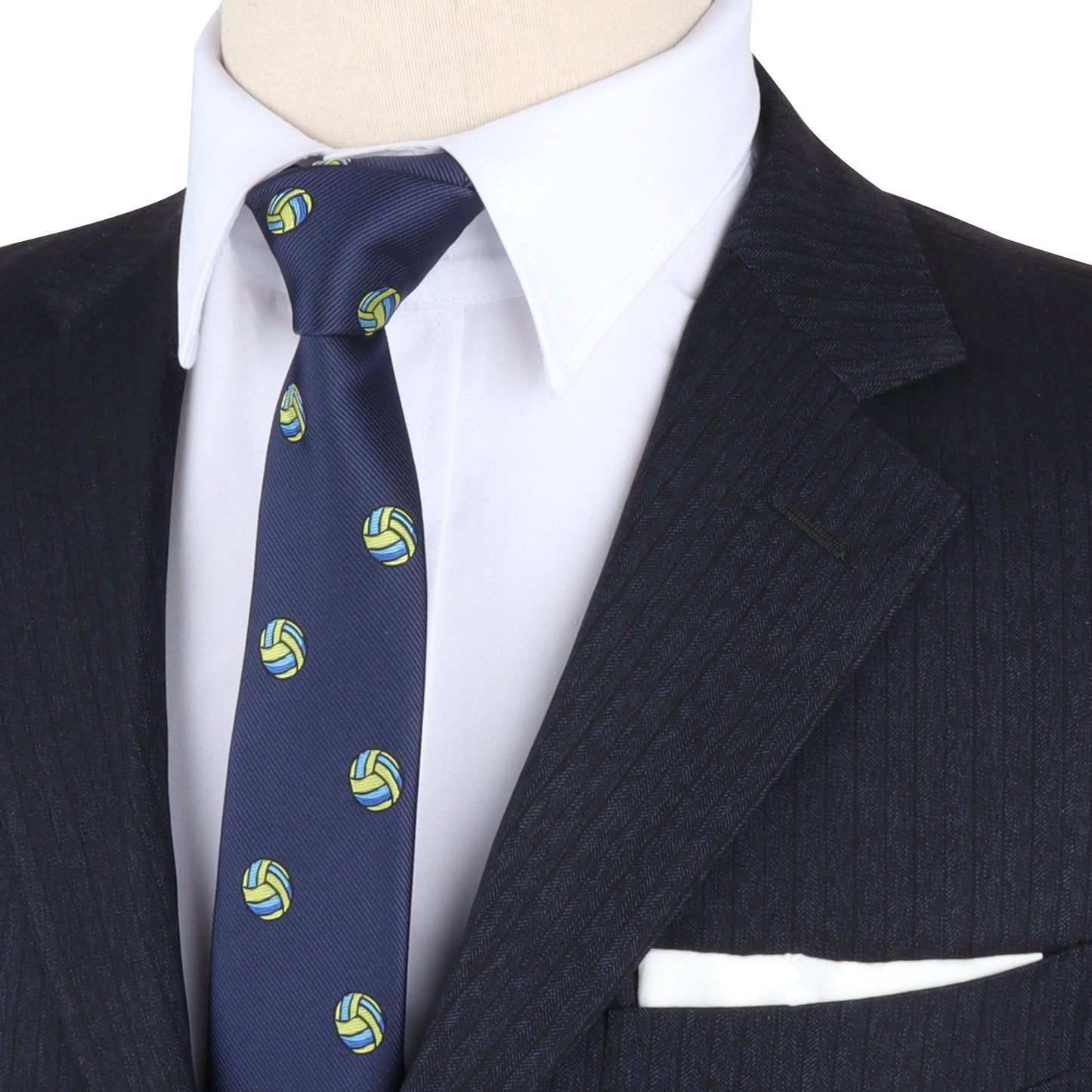 Close-up of a suit jacket and tie that elevates your style. The dark suit features subtle stripes, while the Volleyball Gift in navy blue boasts yellow and green volleyball motifs, adding sporty finesse. A white dress shirt and pocket square complete the look.