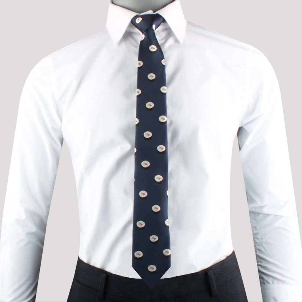 Man wearing a white dress shirt, a Wasabi and Soy Sauce Tie with a pattern of small circular designs, and gray trousers exudes modern charm.