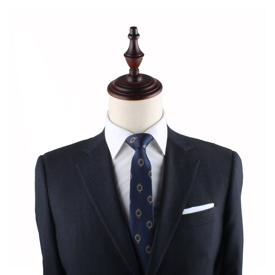 Navy blue suit jacket on a mannequin with a Watch Slim Tie, white pocket square, and a wooden neck stand against a white background, epitomizing timeless elegance.