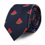 A rolled-up Watermelon Skinny Tie, featuring a pattern of red and green watermelon slices, perfect for adding a touch of summertime freshness to your style.