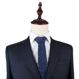 A mannequin dressed in a navy blue suit with a Red Parrot Skinny Tie.