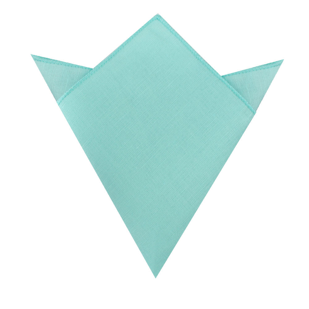 Aqua Bow Tie and Pocket Square set arranged with finesse into a symmetrical crown shape on a white background.