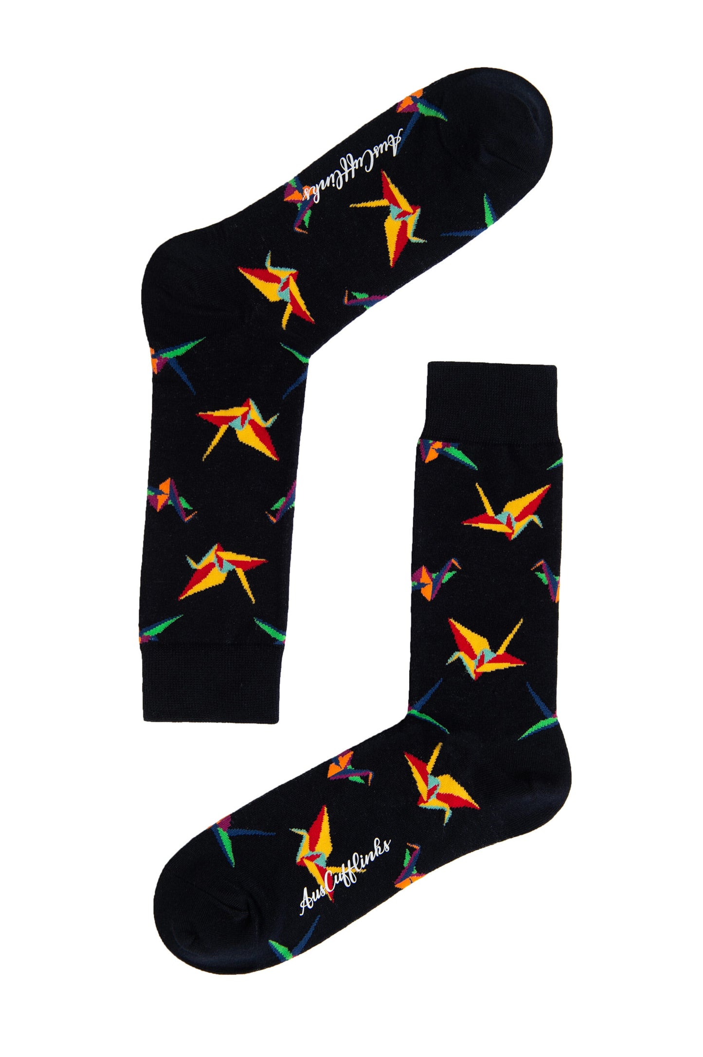The Origami Socks, featuring a striking black design with colorful origami crane patterns, are displayed with one sock laid horizontally and the other positioned vertically to showcase their artistic craftsmanship.