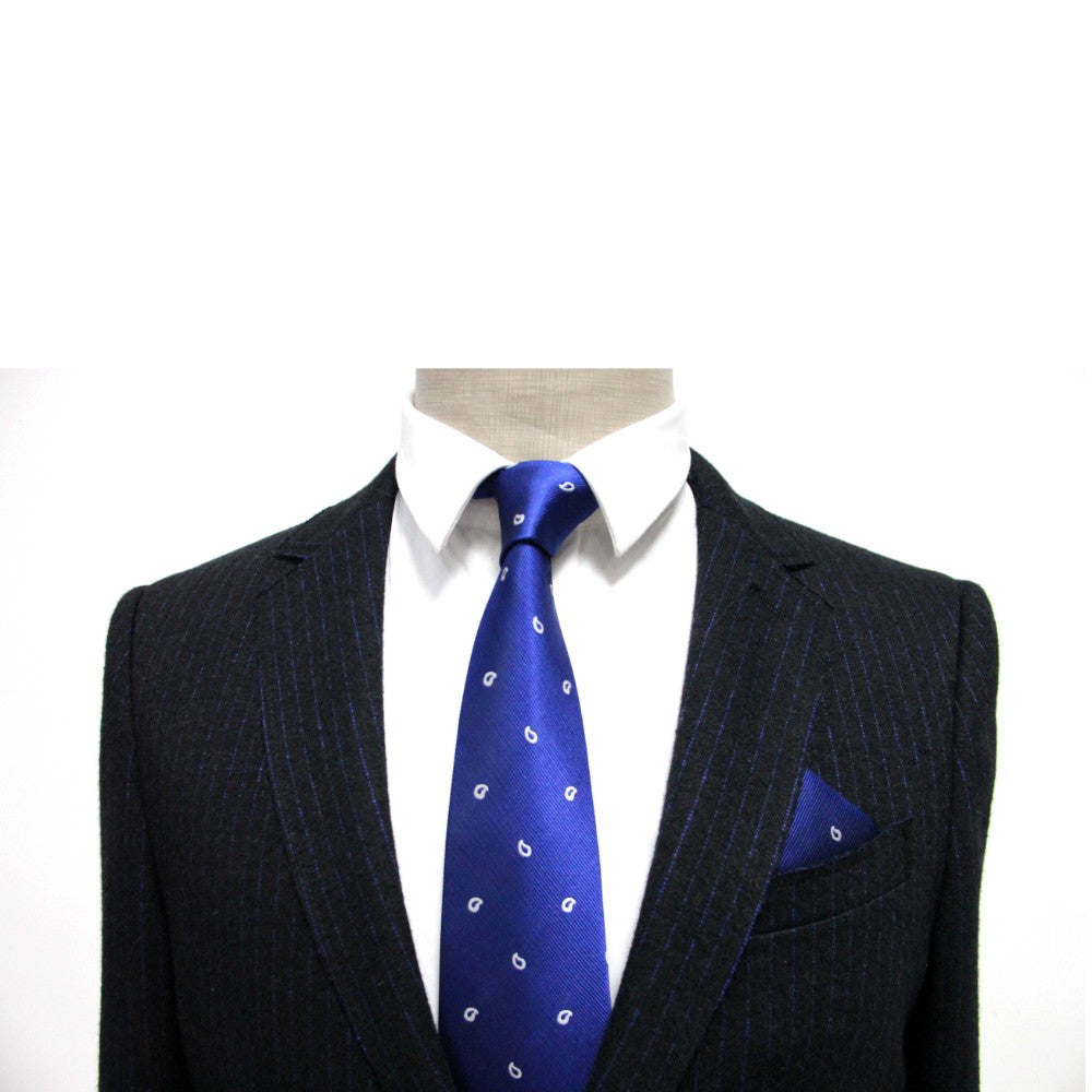 A mannequin is styled in a pinstripe suit, white shirt, blue patterned tie, and enhanced with the sophisticated Navy White Tear Drop Pocket Square.