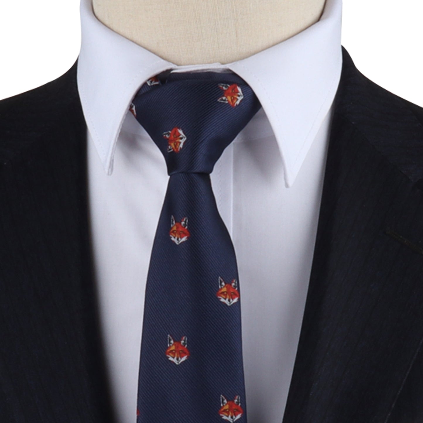 A mannequin wearing a Wildlife Skinny Tie with a cunning charm.