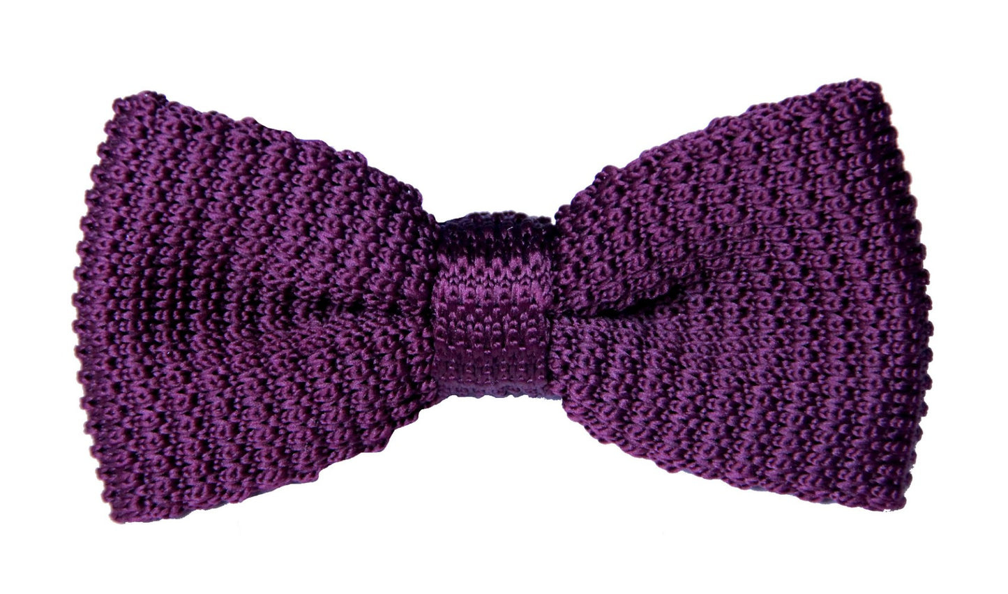 The Wine Knit Bow Tie, with a textured pattern on a white background, is crafted from premium knit fabric for a stylish look.