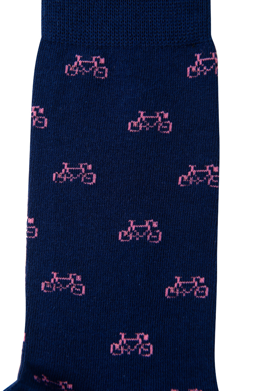 A close-up of the Pink Bike Socks showcasing the charming bright blue base with a playful pink bicycle pattern, ensuring ultimate comfort for every pedal.