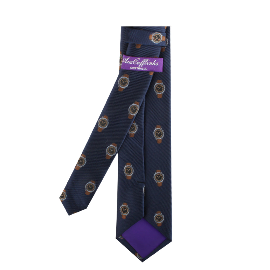 Wristwatch Print Tie with circular gold patterns, embodying timeless elegance, displayed in an open purple gift box with a "just cufflinks" label.