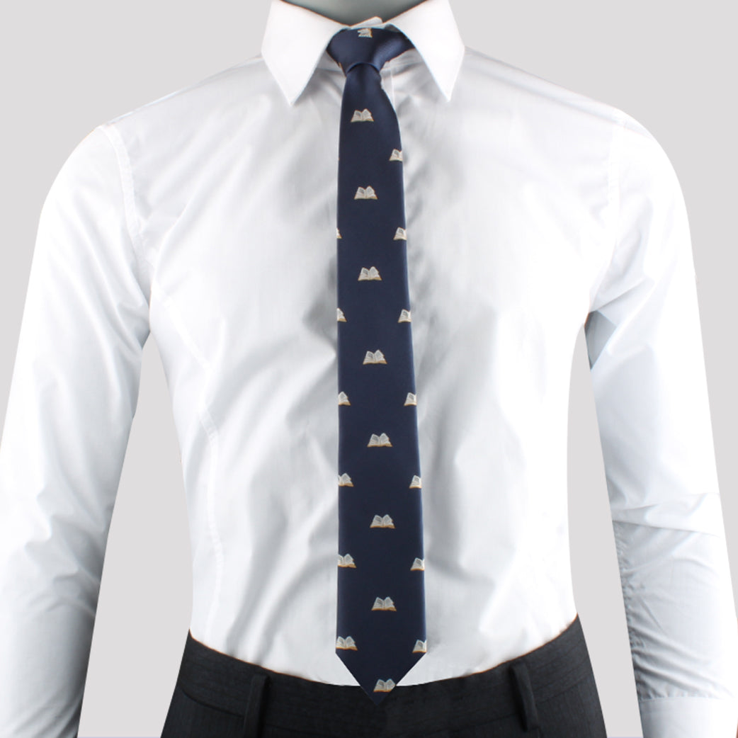 A mannequin dressed in a refined fashion, wearing a white shirt and Writer Tie.