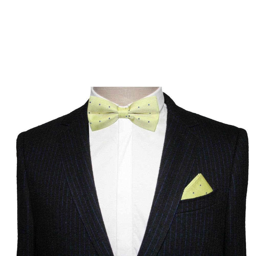 A dark pinstriped suit with a white dress shirt, enhanced by a Green Navy Polka Dot Bow Tie and matching pocket square, creates a perfect formal look for special occasions.