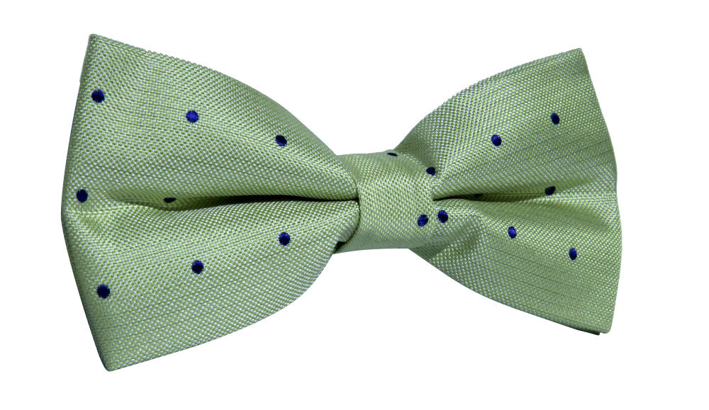 Elevate your style with our Green Navy Polka Dot Bow Tie, showcasing small blue polka dots on a clean white background. Perfectly crafted for formal occasions, it adds a touch of elegance to any look.