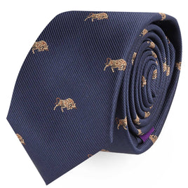 The Raging Bull Skinny Tie, featuring small embroidered images of bison on a rolled-up dark blue fabric, exudes power and determination, making a bold statement.