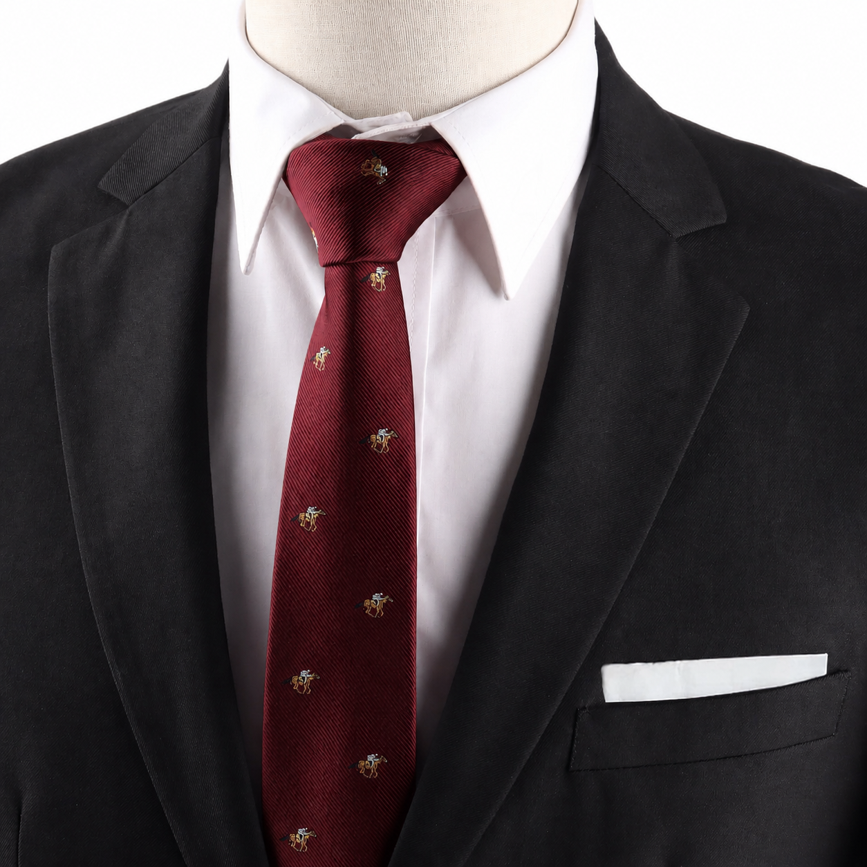 A person wearing a dark suit jacket, white dress shirt, and the Horse Racing Skinny MAROON Tie with small embroidered designs, paired with a white pocket square.