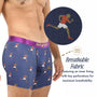 A person wears Athletics Underwear in blue with a runner pattern, featuring breathable fabric and a perforated inner lining for improved ventilation.