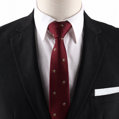 A mannequin dressed in a black suit jacket, white dress shirt, and the Horse Racing Skinny MAROON Tie with small embroidered patterns, complemented by a white pocket square.