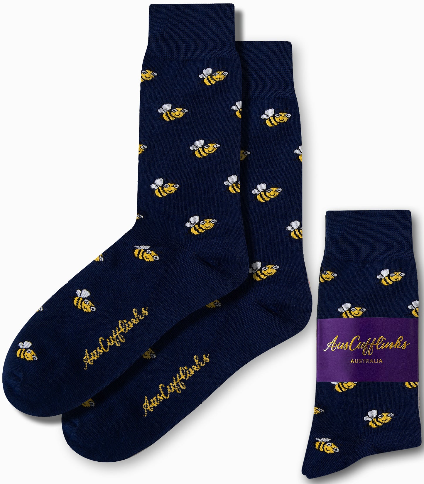 The Bee Socks, in navy blue with a yellow bee pattern, provide honeyed comfort for your day and feature a purple label that reads "AusCufflinks Australia.