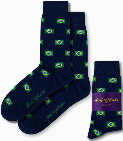 Pair of Brazil Flag Socks in dark blue, showcasing vibrant Brazilian flag patterns and exuding Samba vibes. One sock is displayed separately alongside a folded pair wrapped in branded packaging.