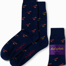 Navy blue socks with striking red cardinal bird patterns, packaged and branded as "AusCufflinks," these embody a touch of elegance perfect for any playful yet sophisticated wardrobe.