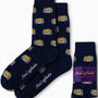 Gamer DJ Socks in navy blue feature a repeating cartoon fox design and "AussieCufflinks" branding, shown both unfolded and packaged with a purple label—fun gamer socks to add playful flair to your style.
