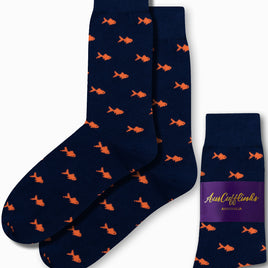 Gold Fish Socks in a navy blue color featuring an orange fish pattern, reminiscent of a serene golden pond, displayed alongside the matching packaging.