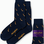 Two dark blue Ice Hockey Socks featuring yellow patterns and "AusCufflinks" branding, paired beside a folded set with a purple label. Elevate your style with these stylish accessories.