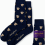 Introducing our Labrador Dog Socks: a stylish pair of navy socks adorned with an eye-catching pattern of repeating white dog faces. Experience unmatched comfort and quality, highlighted by the "AusCufflinks Australia" embroidery on the side.