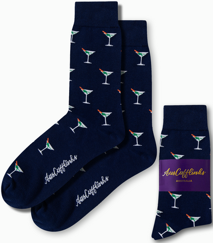 Enhance your sock collection with the Martini Margarita Socks in a deep blue hue, featuring playful martini glass designs. A purple band showcasing "AusCufflinks Australia" adds a splash of vibrant style to your outfit.