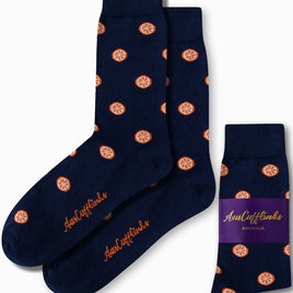 Navy socks adorned with a striking orange fruit pattern and matching logo, delivering citrus-inspired comfort from toe to heel. Wrapped with a purple band labeled "AusCufflinks Australia," these are known as Orange Socks.