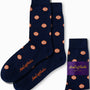 Navy socks adorned with a striking orange fruit pattern and matching logo, delivering citrus-inspired comfort from toe to heel. Wrapped with a purple band labeled "AusCufflinks Australia," these are known as Orange Socks.