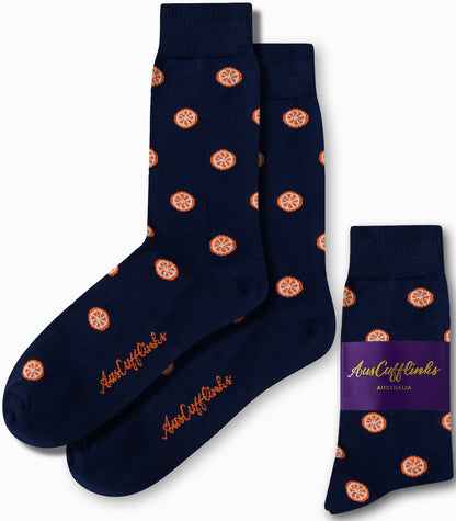 Navy socks adorned with a striking orange fruit pattern and matching logo, delivering citrus-inspired comfort from toe to heel. Wrapped with a purple band labeled "AusCufflinks Australia," these are known as Orange Socks.