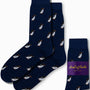 Navy blue Penguin Socks adorned with a pattern of small penguins, exuding arctic allure, come in packaging labeled "AusCufflinks Australia.