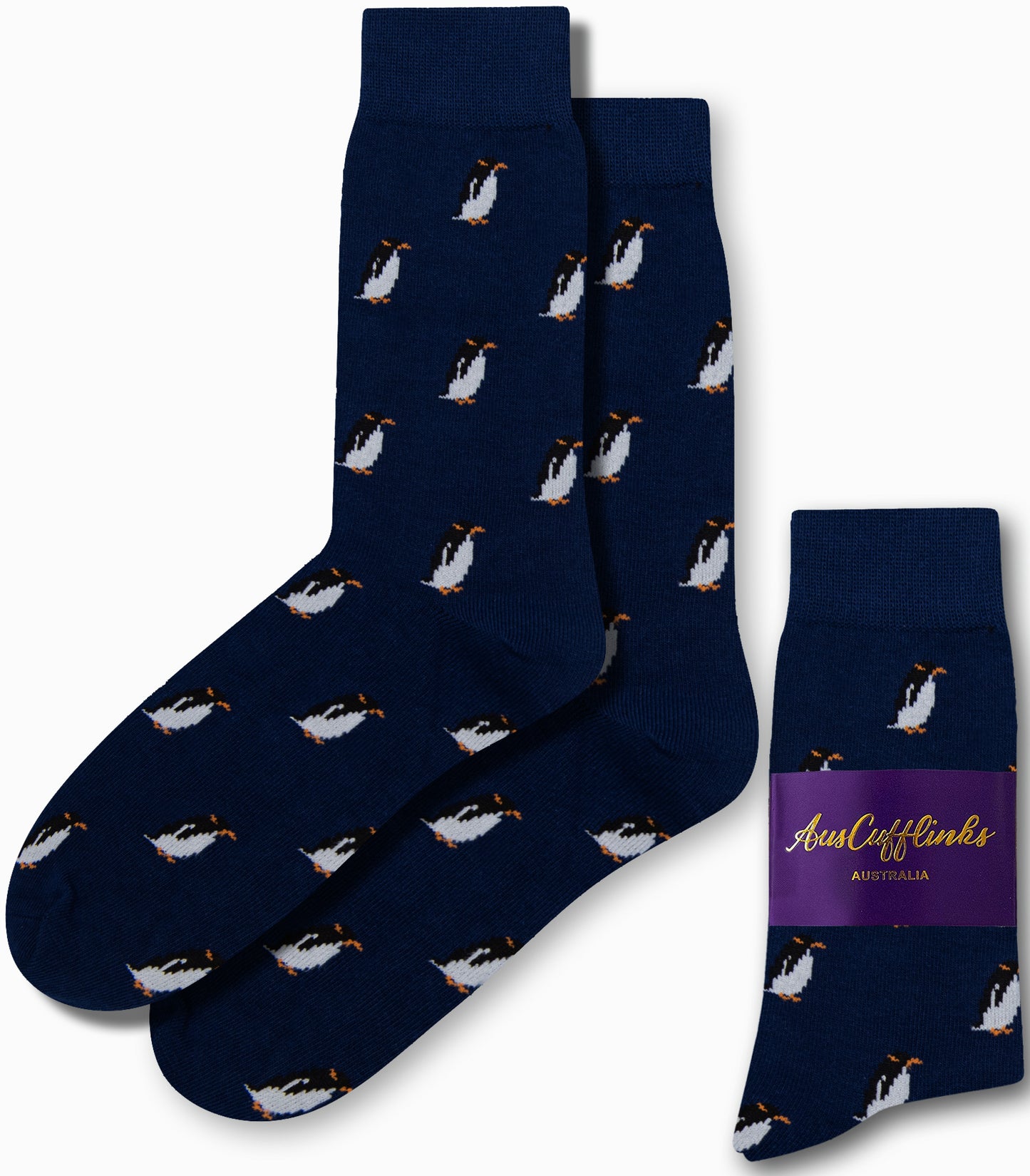 Navy blue Penguin Socks adorned with a pattern of small penguins, exuding arctic allure, come in packaging labeled "AusCufflinks Australia.