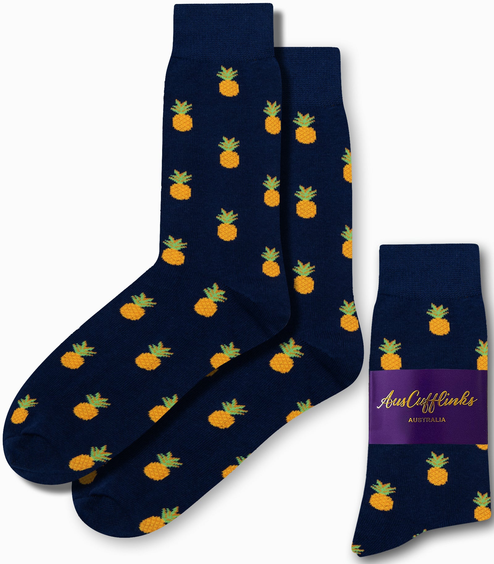 The Pineapple Socks feature a tropical design with vibrant yellow pineapples on a navy blue background, providing comfort from heel to toe and accented with a chic purple label.