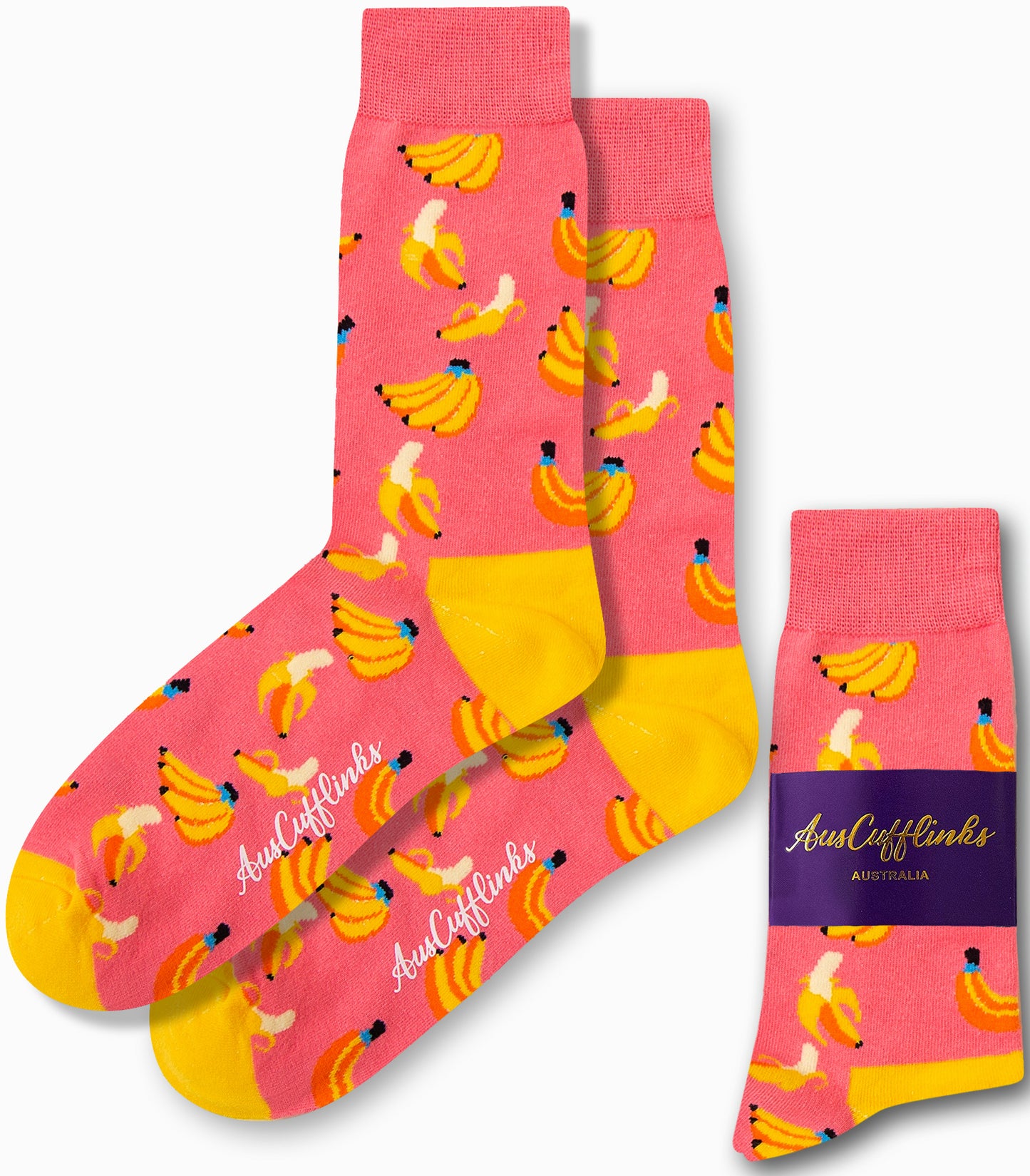 Banana Pink Socks, featuring a playful pattern of bananas in tropical hues with yellow heels and toes, displayed alongside their packaging.