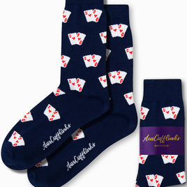 Navy blue Poker Socks showcasing white playing card motifs adorned with red hearts, embodying the latest fashion trends, packaged with a label stating "Aus Cufflinks Australia.