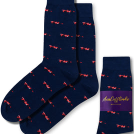 Navy blue socks featuring a red bicycle design, with one pair laid flat and another folded, are ready to take your sock game up a notch. These socks come with a purple label that reads "AusCufflinks Australia.