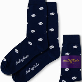 Navy blue rugby socks showcasing a sporty white cricket ball pattern and "AusCufflinks" branding near the toes. Designed to tackle any stride with style, one sock is folded with packaging visible.