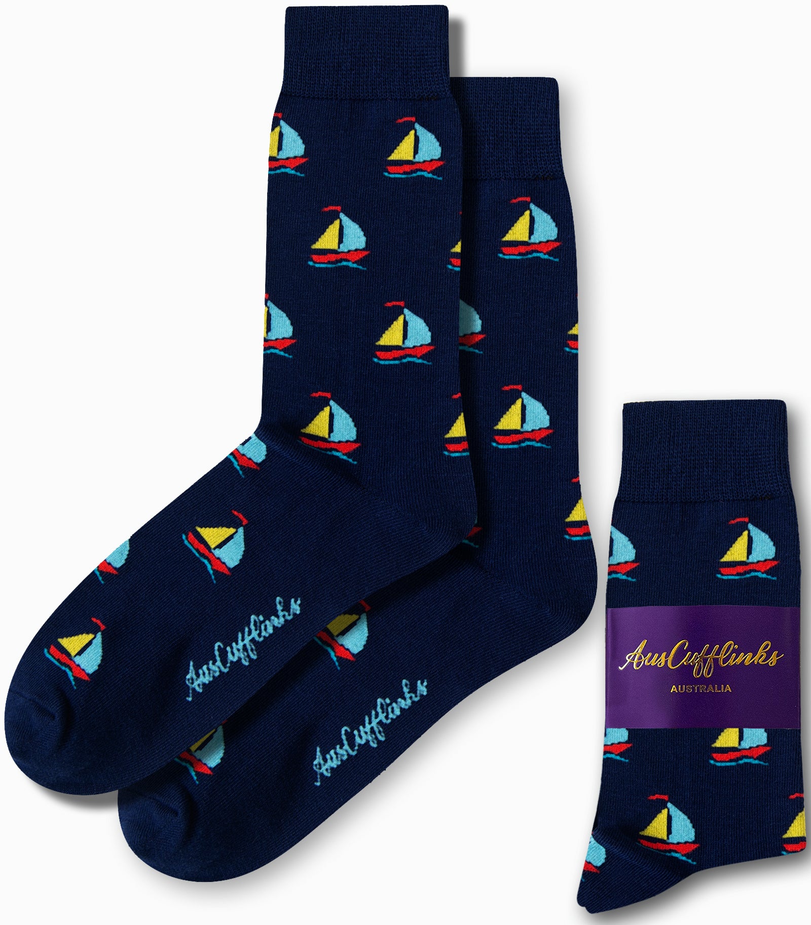 Experience the comfort of AusCufflinks craftsmanship with our Sail Boat Socks, featuring navy blue fabric embellished with a small, colorful sailboat pattern gliding along subtle wave designs.