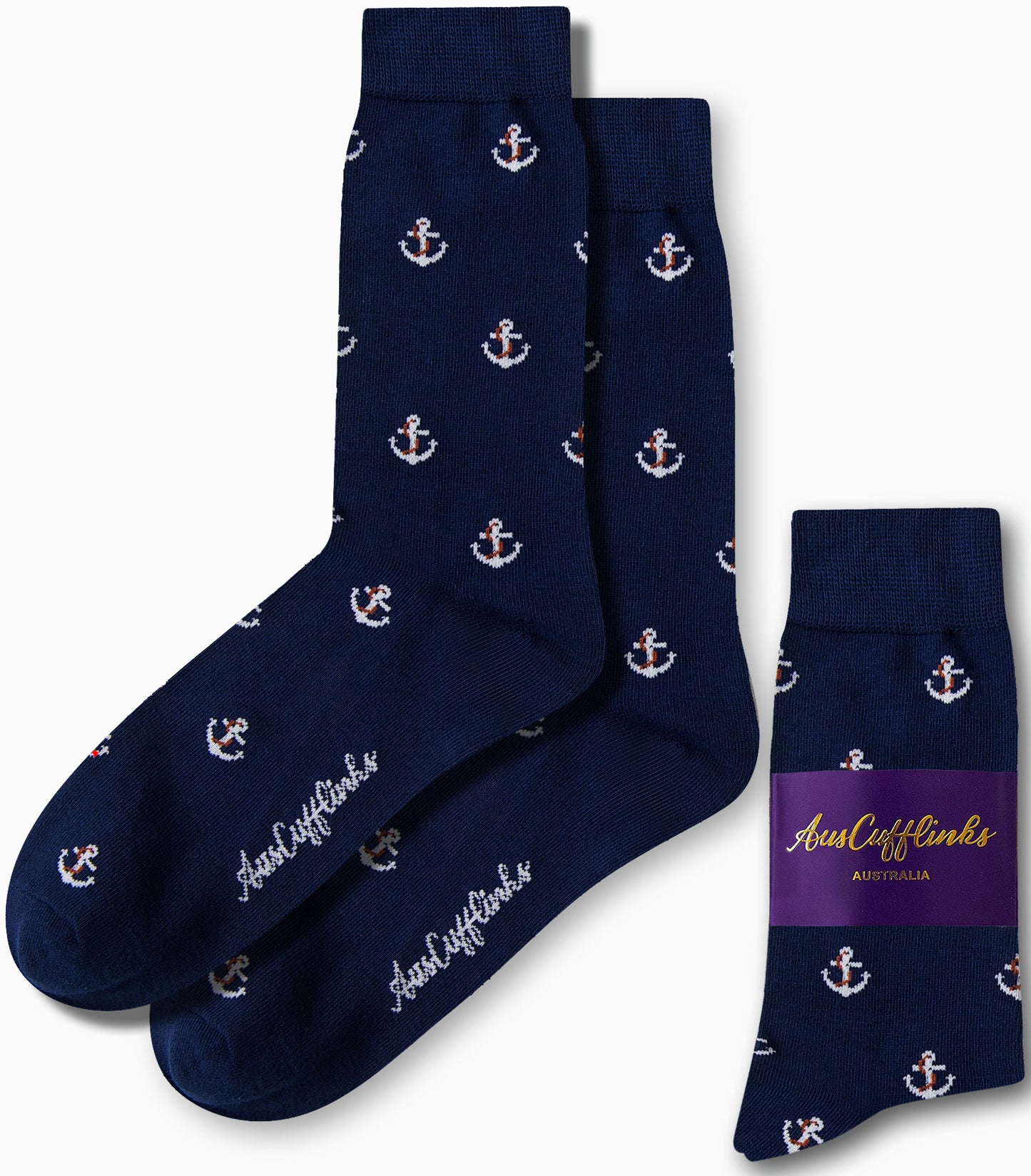 The Anchor Socks by AusCufflinks, featuring navy blue with white anchor patterns, exude nautical charm as they are elegantly laid out next to their packaging.