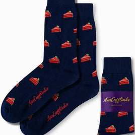 Navy blue socks featuring a charming red cake slice pattern, packaged with a purple label that reads "Strawberry Cake Socks by AusCufflinks Australia.