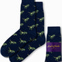 Two pairs of T-Rex Socks, featuring navy with green dinosaur patterns and a purple label, offer both style and comfort, adding a touch of Jurassic joy to your wardrobe.